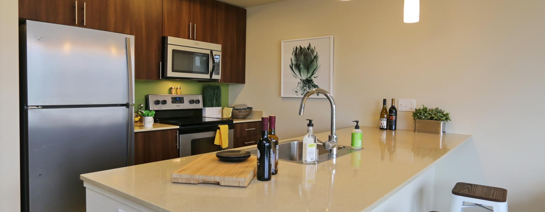 a kitchen with a table and chairs